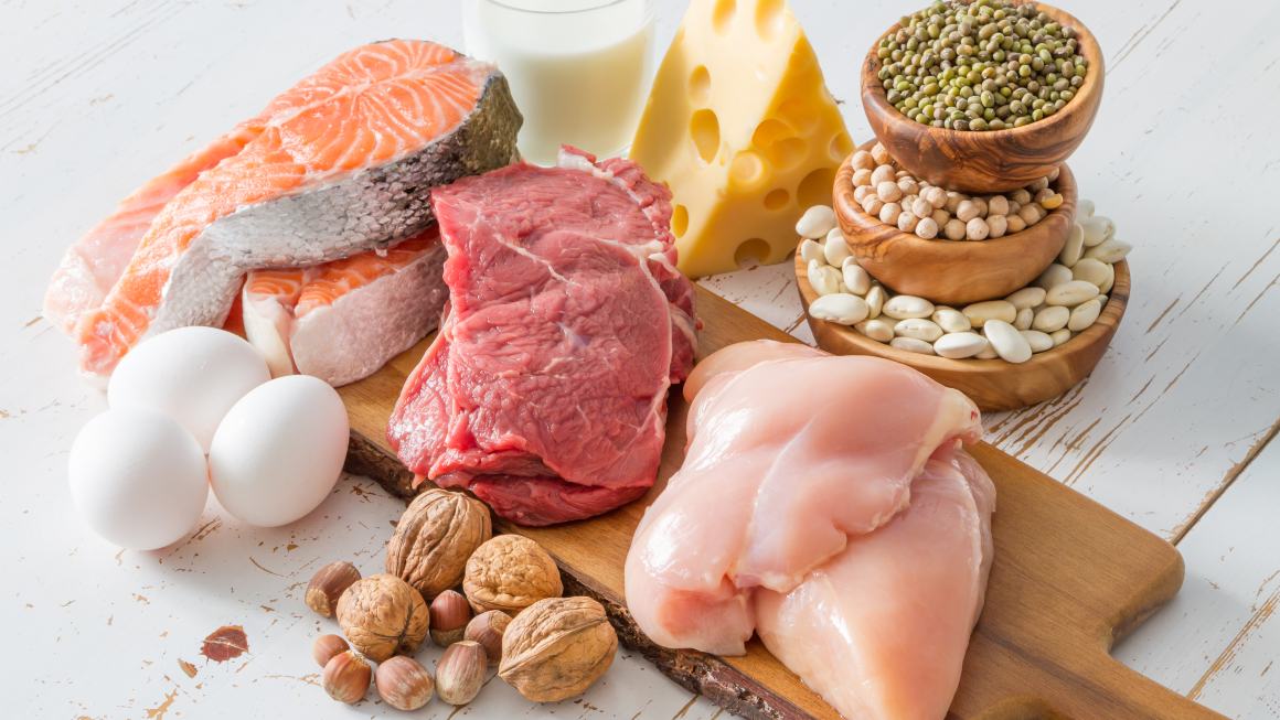 Selection of protein sources in kitchen background, copy space